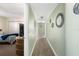 Hallway with light walls and mirrors at 50 Meredith Dr # 12, Englewood, FL 34223