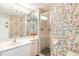 Bathroom with walk-in shower and floral wallpaper at 5000 Gasparilla Rd # 48, Boca Grande, FL 33921