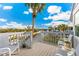 Spacious deck overlooking the neighborhood and palm trees at 5000 Gasparilla Rd # 48, Boca Grande, FL 33921