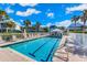 Inviting community pool with plenty of lounge chairs for relaxation at 5000 Gasparilla Rd # 48, Boca Grande, FL 33921