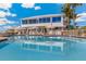 Stunning resort pool with ocean views and ample seating for relaxation at 5000 Gasparilla Rd # 48, Boca Grande, FL 33921