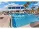 Inviting resort pool area with ocean views and plenty of seating at 5000 Gasparilla Rd # 48, Boca Grande, FL 33921