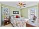 Bedroom with a king-size bed and floral bedding at 601 Bramblewood Ln, Englewood, FL 34223