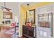 Elegant entryway with a view into the kitchen and a charming console table at 601 Bramblewood Ln, Englewood, FL 34223