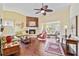 Spacious living room featuring a cozy fireplace and hardwood floors at 601 Bramblewood Ln, Englewood, FL 34223