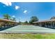 Community shuffleboard courts with covered seating at 601 Bramblewood Ln, Englewood, FL 34223