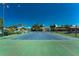 Community tennis court with green turf at 601 Bramblewood Ln, Englewood, FL 34223