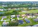 Aerial view of a single-Gathering home in a residential neighborhood at 70 Marker Rd, Rotonda West, FL 33947