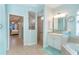 Bathroom with walk-in shower, soaking tub, and double vanity at 70 Marker Rd, Rotonda West, FL 33947