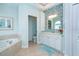 Spa-like bathroom with a large vanity, soaking tub, and separate toilet area at 70 Marker Rd, Rotonda West, FL 33947