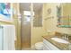 Clean bathroom with shower, toilet, and granite countertop at 70 Marker Rd, Rotonda West, FL 33947