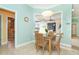 Kitchen breakfast nook with view of the backyard through a large window at 70 Marker Rd, Rotonda West, FL 33947