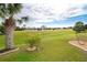 Backyard view of lush green golf course at 70 Marker Rd, Rotonda West, FL 33947