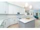 Modern kitchen island with granite countertop and pendant lighting at 70 Marker Rd, Rotonda West, FL 33947