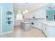 Modern kitchen with white cabinets and a center island at 70 Marker Rd, Rotonda West, FL 33947