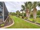 Landscaped backyard with lush greenery at 70 Marker Rd, Rotonda West, FL 33947