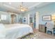 Spacious main bedroom with king bed, private access to the bathroom, and built-in desk at 70 Marker Rd, Rotonda West, FL 33947