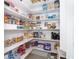 Well-organized pantry with ample shelving for food storage at 70 Marker Rd, Rotonda West, FL 33947