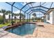 Screened-in pool and patio with seating for relaxation at 70 Marker Rd, Rotonda West, FL 33947