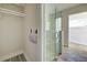 Bathroom with walk-in shower and closet at 701 W Perry St, Englewood, FL 34223