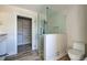 Bathroom with walk-in shower and built-in shelving at 701 W Perry St, Englewood, FL 34223