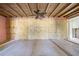 Unfinished bedroom with exposed wood framing and flooring at 701 W Perry St, Englewood, FL 34223