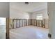 Unfinished bedroom with exposed walls and carpet at 701 W Perry St, Englewood, FL 34223