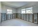 Unfinished bedroom with exposed walls and carpet at 701 W Perry St, Englewood, FL 34223