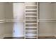 Large walk-in closet with built-in shelving at 701 W Perry St, Englewood, FL 34223