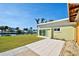 Light green house with a large patio overlooking the canal at 701 W Perry St, Englewood, FL 34223