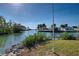 Relaxing view of the canal and neighboring houses at 701 W Perry St, Englewood, FL 34223