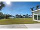 Expansive view of the canal from a home's grassy backyard at 701 W Perry St, Englewood, FL 34223