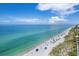 Wide aerial view of a sandy beach with clear, blue water at 7510 Kenway St, Englewood, FL 34224