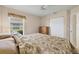 Bedroom with a queen-size bed, dresser, and large closet at 80 Long Meadow Ln, Rotonda West, FL 33947