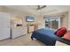 Comfortable bedroom with a queen-size bed and patio access at 80 Long Meadow Ln, Rotonda West, FL 33947