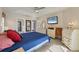 Spacious bedroom with a large bed, dresser, and TV at 80 Long Meadow Ln, Rotonda West, FL 33947