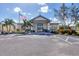 Community center with welcoming entrance and American flag at 80 Long Meadow Ln, Rotonda West, FL 33947