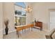 Formal dining area with a drop leaf table and large window at 80 Long Meadow Ln, Rotonda West, FL 33947