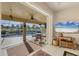 Living room with pool view, sliding doors, and comfortable seating at 80 Long Meadow Ln, Rotonda West, FL 33947