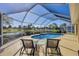 Enjoy this refreshing pool with screened enclosure and comfortable lounge chairs at 80 Long Meadow Ln, Rotonda West, FL 33947