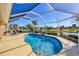 Enjoy the refreshing pool with screened enclosure and relaxing patio space at 80 Long Meadow Ln, Rotonda West, FL 33947