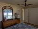 Bedroom with dresser, mirror, and ceiling fan at 839 E 4Th St, Englewood, FL 34223