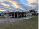 View of home's side and carport at 839 E 4Th St, Englewood, FL 34223