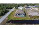 Aerial view of a single-Gathering home with a private pool and canal-front at 8626 Agate St, Port Charlotte, FL 33981