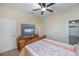 Bedroom with coastal bedding and a view of the hallway at 8626 Agate St, Port Charlotte, FL 33981