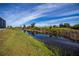 Peaceful canal view from the backyard, lush landscape at 8626 Agate St, Port Charlotte, FL 33981