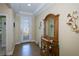 Welcoming entryway with decorative mirror and tiled floor at 8626 Agate St, Port Charlotte, FL 33981