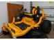 Garage with yellow Cub Cadet Ultima ZT1 zero-turn lawn mower at 8626 Agate St, Port Charlotte, FL 33981