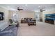 Spacious living room featuring comfortable seating and a large flatscreen TV at 8626 Agate St, Port Charlotte, FL 33981