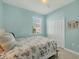 Guest bedroom with a full-size bed and closet at 8746 Saint Kitts Cir, Englewood, FL 34224